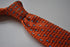 orange skinny knitted tie with light  blue pin spots